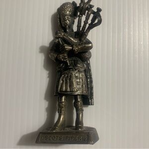 Silver Scots Piper Figurine. I believe it's made of pewter  Scot's piper 3.5"